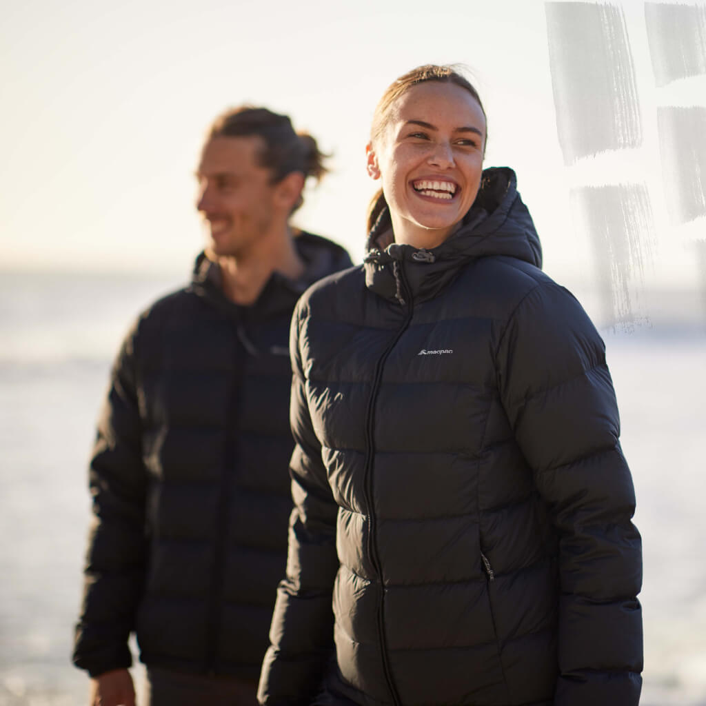 Man and woman wearing black Halo Jackets